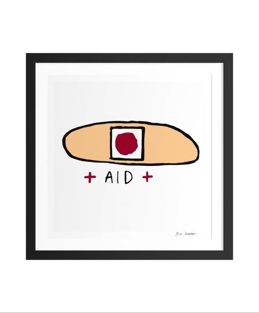 Framed artwork of a bandaid with 'AID' text on a white background