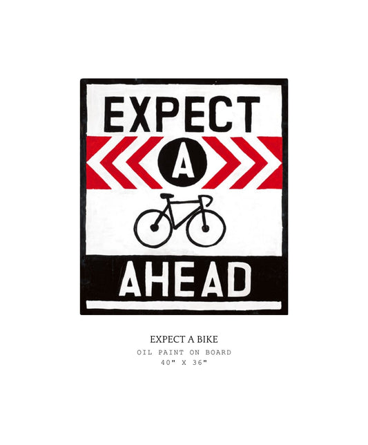 Artistic depiction of a bicycle with 'Expect A Bike Ahead' text on a white background