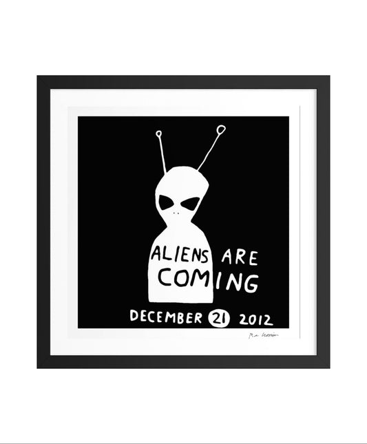 Framed artwork of an alien with 'ALIENS ARE COMING' text on a black background