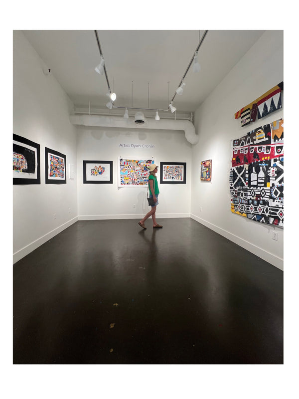 Visitor viewing contemporary artwork at The Cronin Gallery in New Paltz, near Mohonk and the Gunks